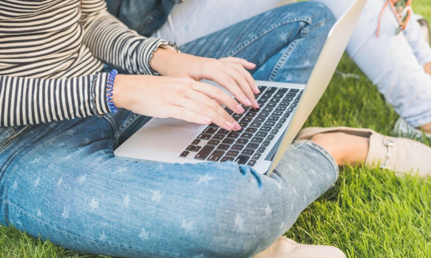 Students collaborating on economic analysis in modern learning environment