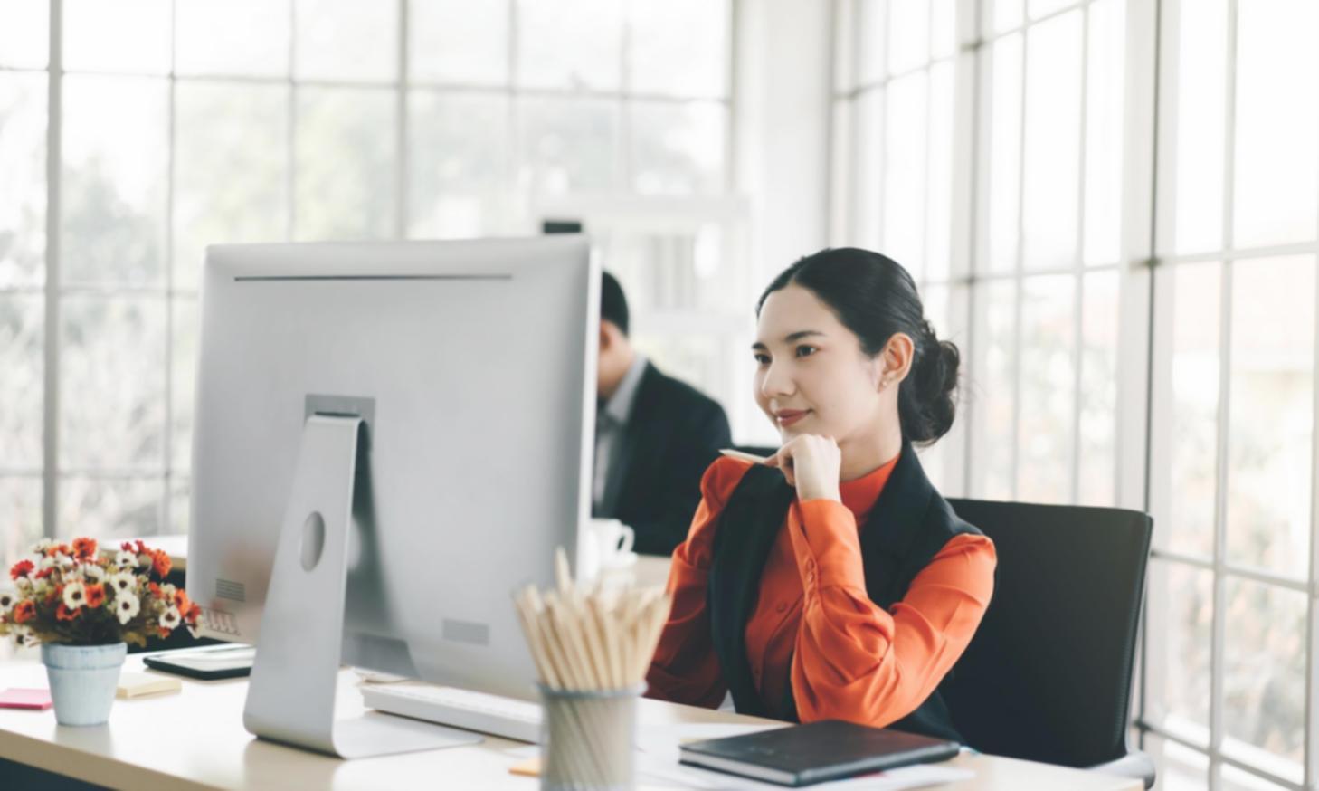 Economic analyst presenting quarterly market analysis with inflation trends and employment statistics displayed on presentation screen